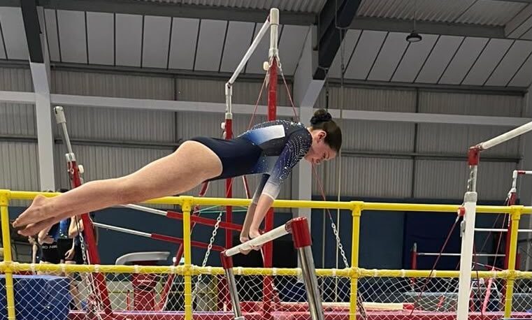 Maldon gymnast performing on the bars